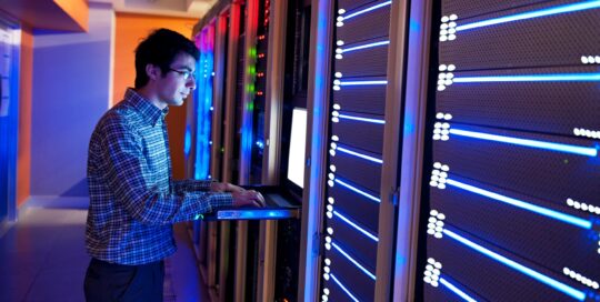 Information Warfare - Man working in a data centre