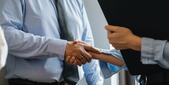 Man & woman shaking hands