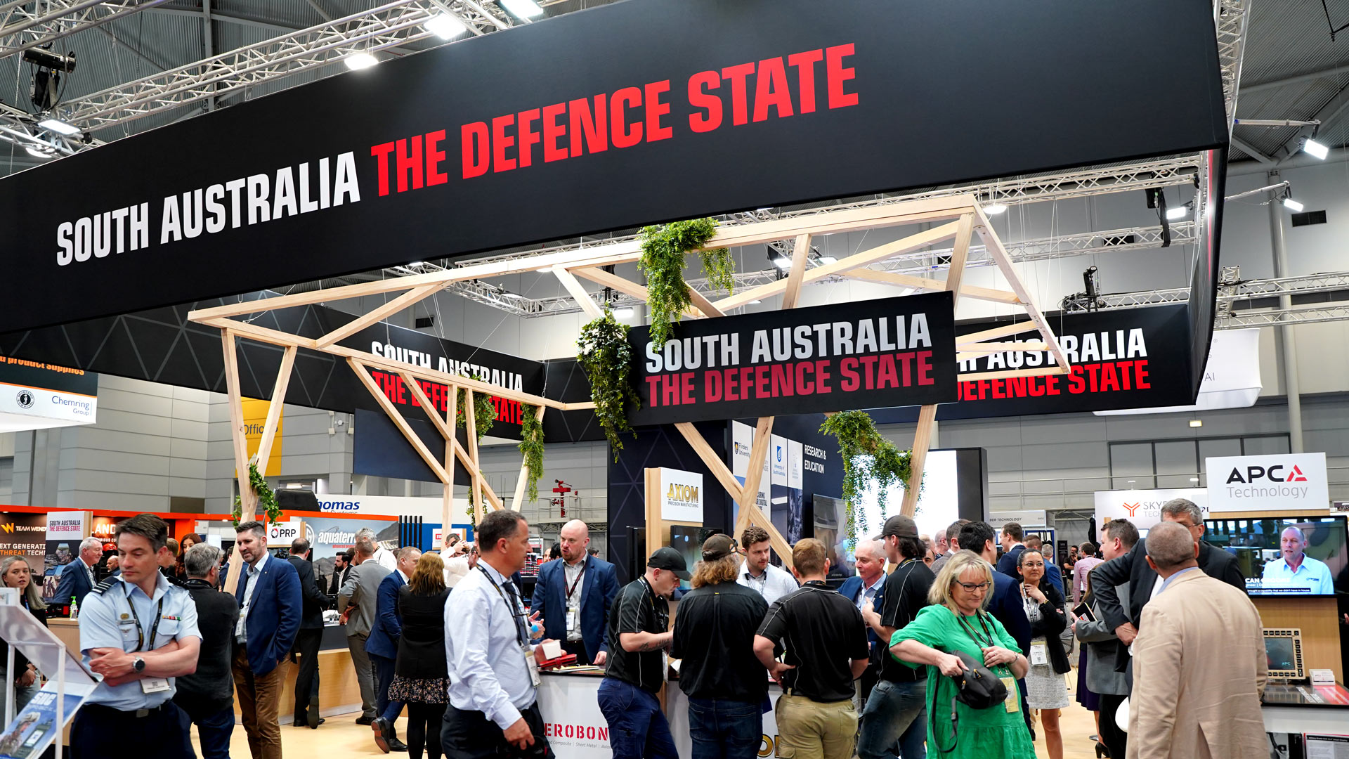Delegates at the South Australia - The Defence State stand at Land Forces 2022 in Brisbane