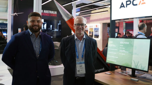 Photo of two people at a trade show
