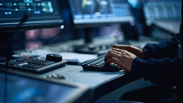 Close up of a person typing on a computer keyboard