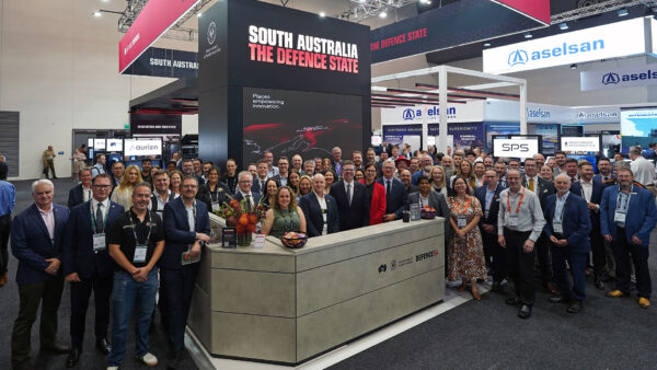 Group of people standing at The Defence State stand at Land Forces event